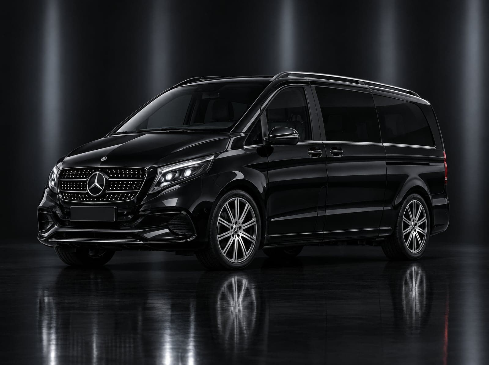 Black Mercedes people carrier in a dark studio, front three-quarter view
